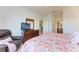 Relaxing bedroom with a comfy chair and large bed at 8105 Grand Estuary Trl # 403, Bradenton, FL 34212