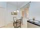 Cozy breakfast nook with a round glass table and two chairs at 8105 Grand Estuary Trl # 403, Bradenton, FL 34212
