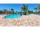 Resort-style pool with plenty of lounge chairs at 8105 Grand Estuary Trl # 403, Bradenton, FL 34212
