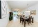 Dining area with table, chairs, and view to living room at 8105 Grand Estuary Trl # 403, Bradenton, FL 34212