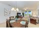 Bright dining area with wood table and access to living room at 8105 Grand Estuary Trl # 403, Bradenton, FL 34212