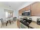 Modern kitchen with stainless steel appliances and granite countertops at 8105 Grand Estuary Trl # 403, Bradenton, FL 34212