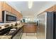 Well-equipped kitchen featuring stainless steel appliances and granite countertops at 8105 Grand Estuary Trl # 403, Bradenton, FL 34212