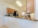 Modern kitchen with stainless steel appliances and granite countertops at 8105 Grand Estuary Trl # 403, Bradenton, FL 34212