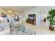 Spacious living room featuring comfortable seating and a large entertainment center at 8105 Grand Estuary Trl # 403, Bradenton, FL 34212