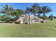 Community entrance with a welcoming waterfall feature at 8105 Grand Estuary Trl # 403, Bradenton, FL 34212