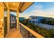 Private balcony with wooden flooring and metal railing, offering a relaxing view at 106 9Th S St, Bradenton Beach, FL 34217