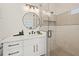 Elegant bathroom with a white vanity and a frameless shower at 106 9Th S St, Bradenton Beach, FL 34217