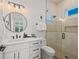 Clean bathroom with walk-in shower and white vanity at 106 9Th S St, Bradenton Beach, FL 34217