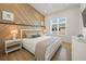 Bedroom with beige accent wall and king bed at 106 9Th S St, Bradenton Beach, FL 34217