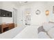 Serene bedroom with a modern TV stand and ensuite bathroom at 106 9Th S St, Bradenton Beach, FL 34217