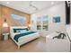 Bright bedroom with teal bedding and geometric wall at 106 9Th S St, Bradenton Beach, FL 34217