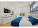 Spacious bedroom featuring a large TV and private balcony access at 106 9Th S St, Bradenton Beach, FL 34217