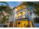 Two-story house with a lighted balcony and patio at 106 9Th S St, Bradenton Beach, FL 34217