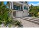 Two-story home with attached two-car garage and landscaped front yard at 106 9Th S St, Bradenton Beach, FL 34217