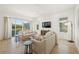 Spacious living room with light colored sofas and large windows at 106 9Th S St, Bradenton Beach, FL 34217