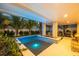Outdoor entertaining area with a large pool and covered patio at 106 9Th S St, Bradenton Beach, FL 34217