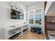 ' room with TV, shelving, and window seat at 106 9Th S St, Bradenton Beach, FL 34217
