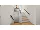 Modern staircase with wooden accents and white walls at 106 9Th S St, Bradenton Beach, FL 34217