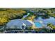 Community clubhouse with pool and surrounding landscape at 1109 Edgewater Cir # 1109, Bradenton, FL 34209