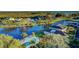 Aerial view of a community pool and surrounding waterfront property at 1109 Edgewater Cir # 1109, Bradenton, FL 34209