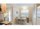 Small breakfast nook with white table and chairs, near kitchen at 1109 Edgewater Cir # 1109, Bradenton, FL 34209