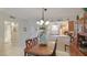 Open concept dining area with kitchen access and breakfast bar at 1109 Edgewater Cir # 1109, Bradenton, FL 34209