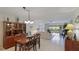 Bright dining area with wood table and chairs, easily fits four people at 1109 Edgewater Cir # 1109, Bradenton, FL 34209