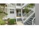 Inviting condo entrance with stairs and landscaping at 1109 Edgewater Cir # 1109, Bradenton, FL 34209