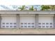 Three-car garage with white doors at 1109 Edgewater Cir # 1109, Bradenton, FL 34209