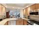 Modern kitchen with granite countertops and stainless steel appliances at 1109 Edgewater Cir # 1109, Bradenton, FL 34209