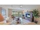 Relaxing living room with comfortable seating and access to a balcony at 1109 Edgewater Cir # 1109, Bradenton, FL 34209