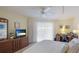 Spacious main bedroom with a large bed, TV, and home office area at 1109 Edgewater Cir # 1109, Bradenton, FL 34209