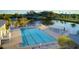 Relaxing community pool with lounge chairs and waterfront views at 1109 Edgewater Cir # 1109, Bradenton, FL 34209