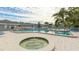 Community pool and spa with lounge chairs for relaxing at 1109 Edgewater Cir # 1109, Bradenton, FL 34209