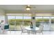 Sunroom with table and chairs, offering water views at 1109 Edgewater Cir # 1109, Bradenton, FL 34209