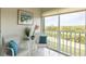 Bright sunroom with seating and serene nature views at 1109 Edgewater Cir # 1109, Bradenton, FL 34209