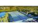 Aerial view of tennis courts with players at 1109 Edgewater Cir # 1109, Bradenton, FL 34209