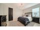 Spacious bedroom with a comfortable bed, dark wood furniture, and a stylish rug at 1115 Mallorca Dr, Bradenton, FL 34209