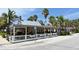 Waterfront restaurant with patio seating and palm trees at 1115 Mallorca Dr, Bradenton, FL 34209