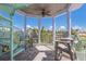 Private balcony with spiral staircase and seating at 112 Mangrove Ave, Anna Maria, FL 34216