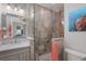 Bathroom with walk-in shower and seashell decor at 112 Mangrove Ave, Anna Maria, FL 34216