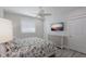 Bedroom with coastal-themed bedding and dresser at 112 Mangrove Ave, Anna Maria, FL 34216