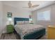 Bedroom with teal bed frame and ocean-themed bedding at 112 Mangrove Ave, Anna Maria, FL 34216