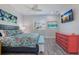 Spacious bedroom with large TV and dresser at 112 Mangrove Ave, Anna Maria, FL 34216