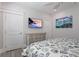 Bedroom with coastal decor, TV, dresser, and seashell bedding at 112 Mangrove Ave, Anna Maria, FL 34216