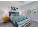 Bright bedroom with a comfy bed and ocean decor at 112 Mangrove Ave, Anna Maria, FL 34216
