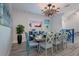 Coastal-themed dining room with seating for eight and ocean view at 112 Mangrove Ave, Anna Maria, FL 34216