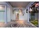 Front entry with mosaic tile floor and unique seaside decor at 112 Mangrove Ave, Anna Maria, FL 34216