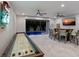 Game room with shuffleboard and bar overlooking pool at 112 Mangrove Ave, Anna Maria, FL 34216